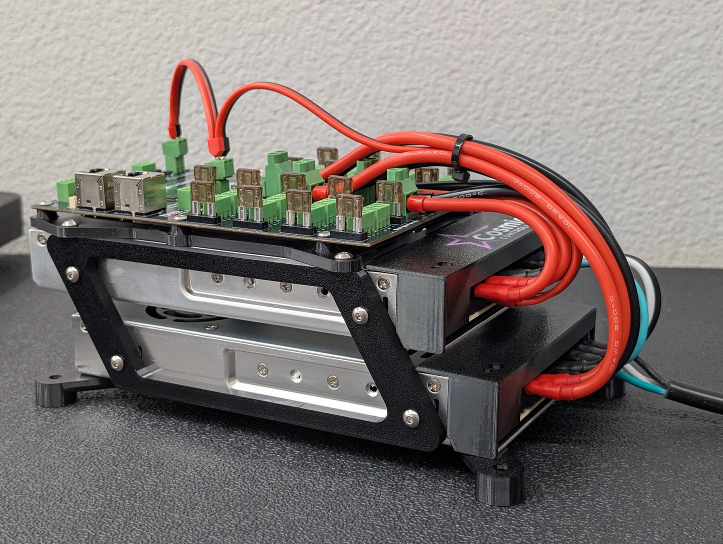 Closeup of Baldrick17 controller board mounted on top of two Mean Well power supplies.