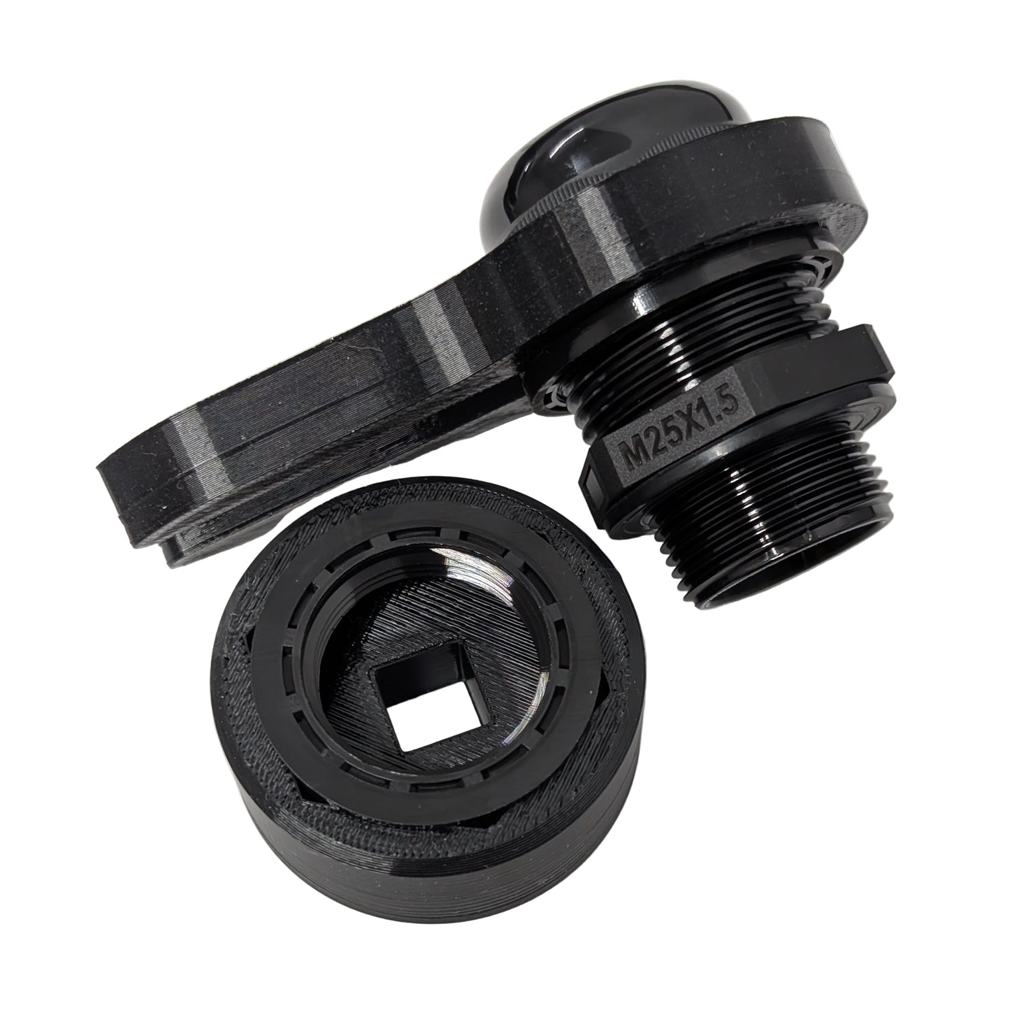 Close up view of two black 33mm cable gland tools on a white background with a M25 cable gland.