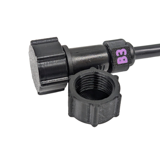 Black female xConnect plug in front of a capped pigtail wire on a white background