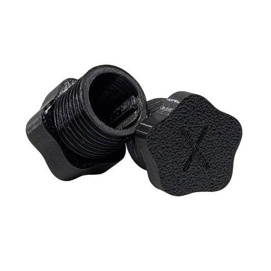 Star shaped black plastic threaded xConnect plug on a white background