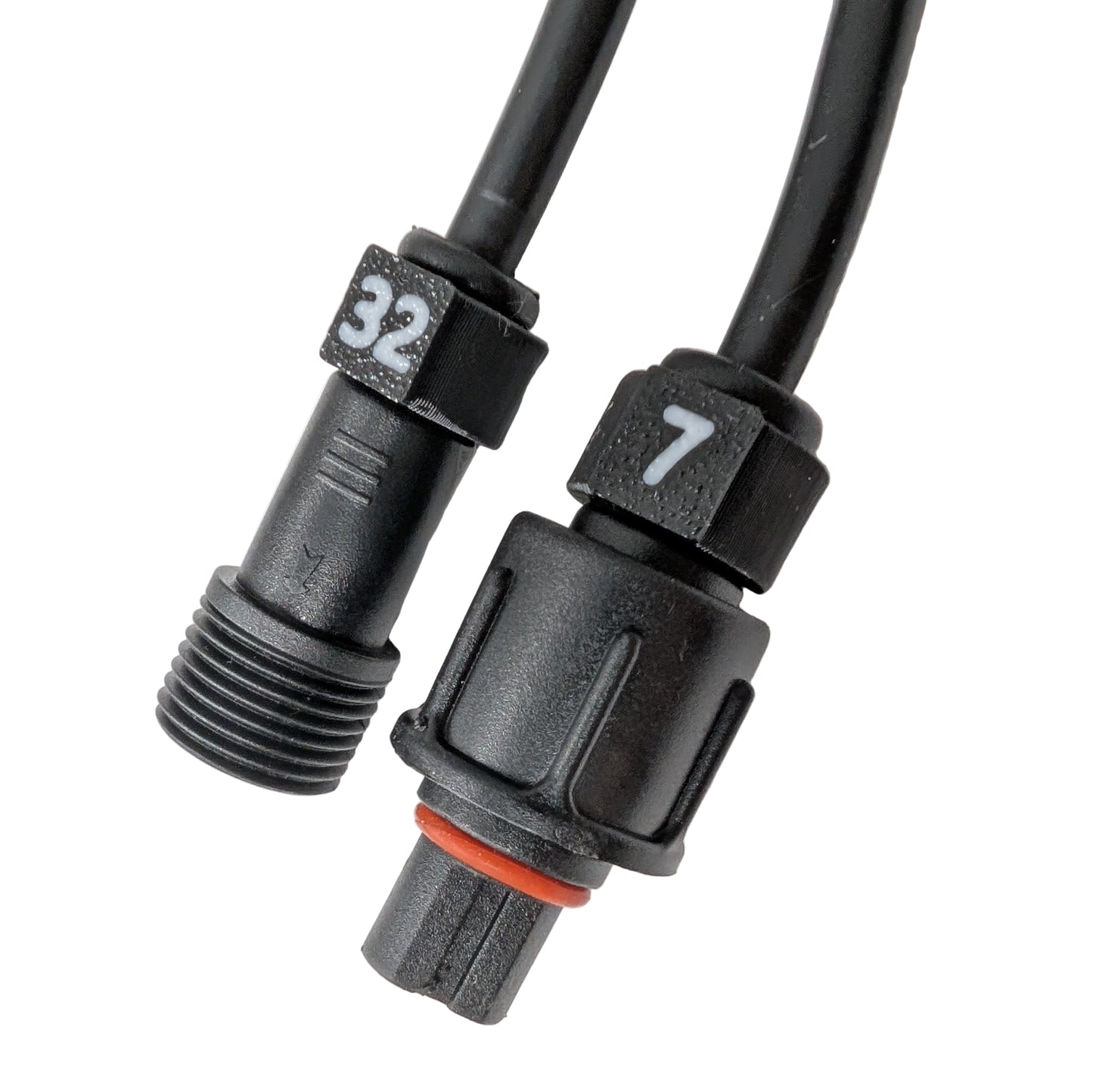 Close-up of black cable ID clips with white numbers installed on the connector of a pigtail wire