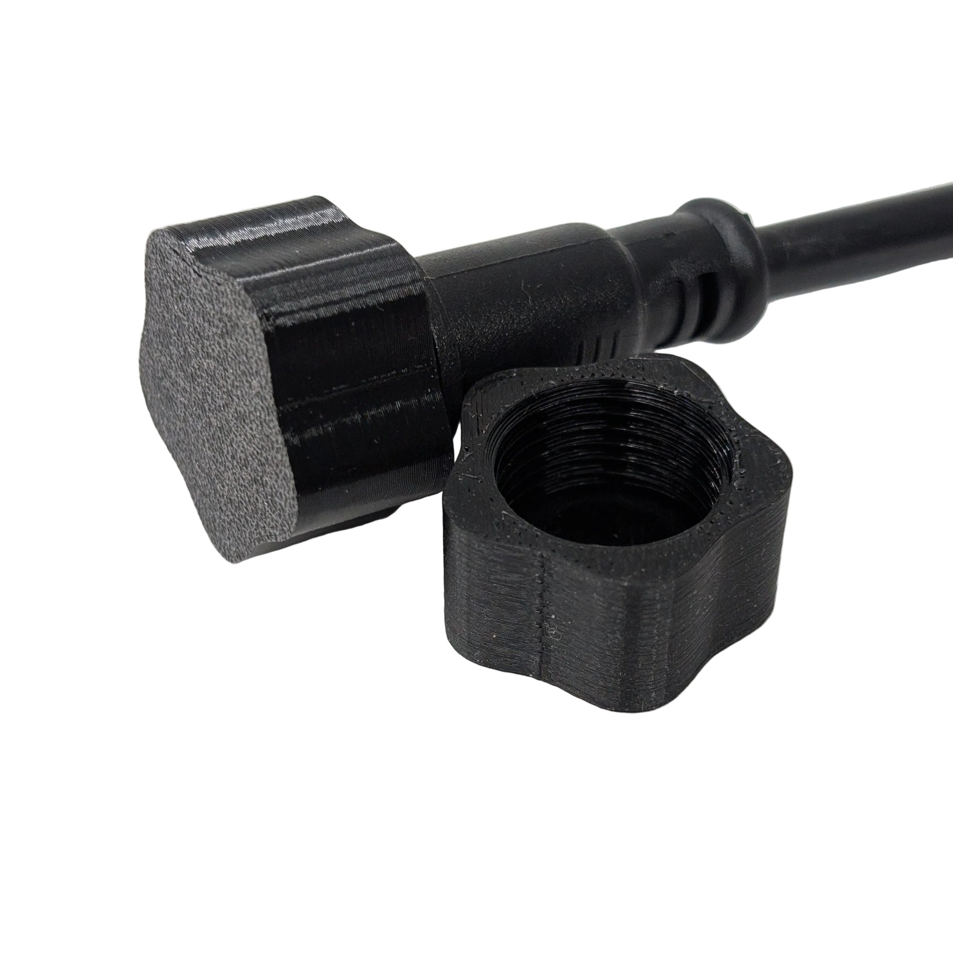Black xConnect female cap and pigtail on a white background.