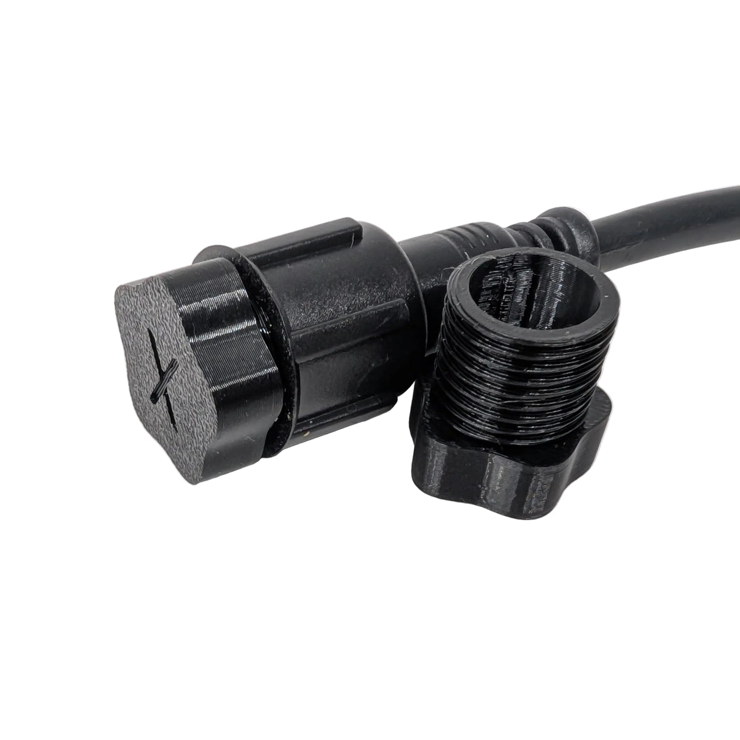 Black xConnect male plug and pigtail on a white background.