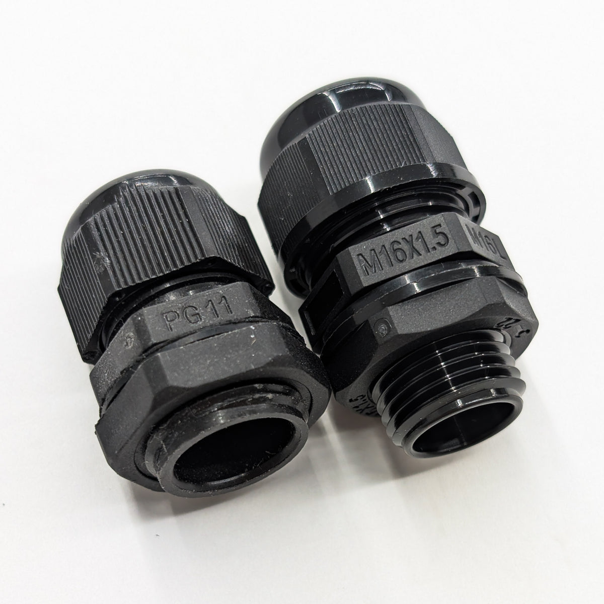 M16L long-thread cable gland compared with a PG11 cable gland showing the longer threaded body and stronger enclosure mounting design