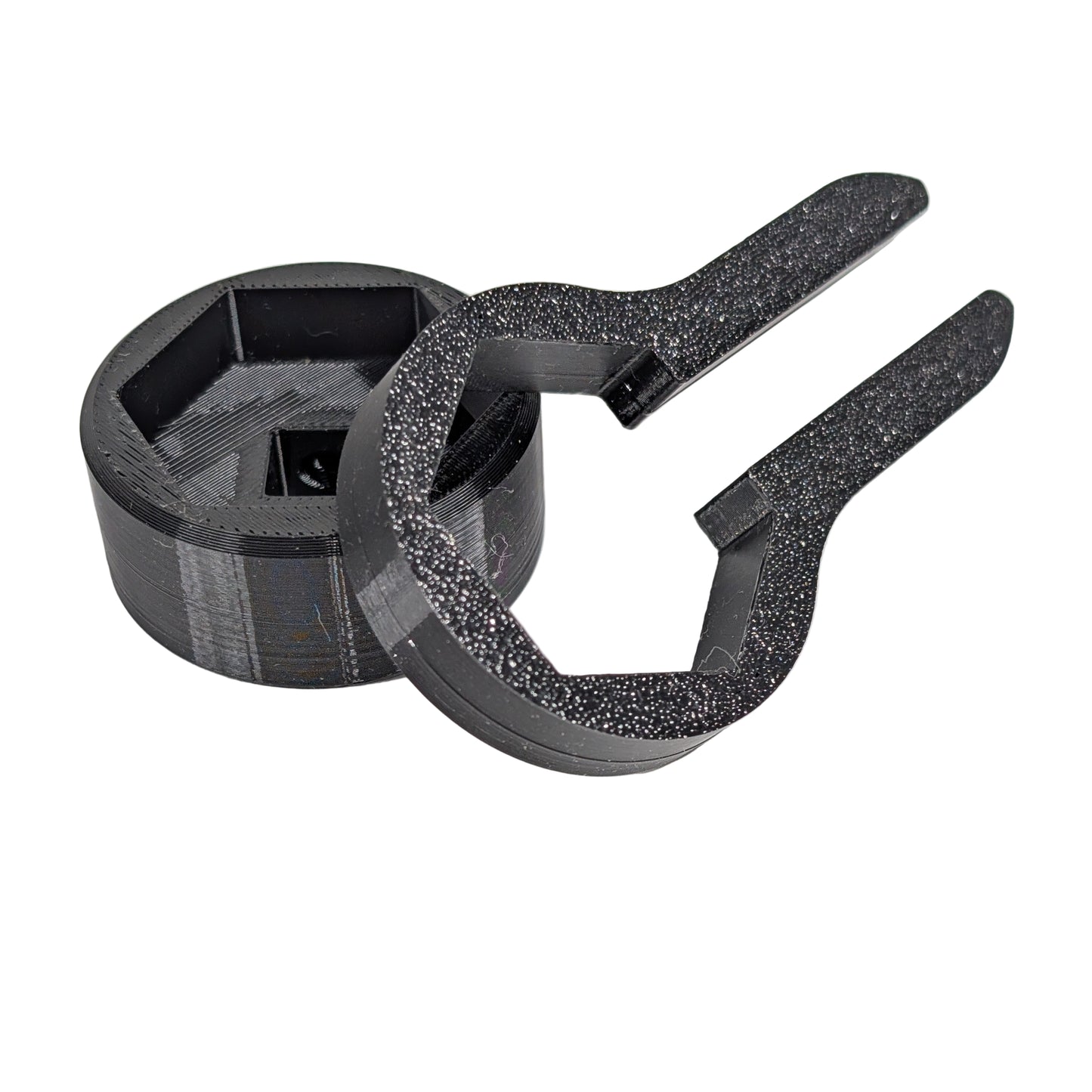 Close up view of two black M25 cable gland tools on a white background.