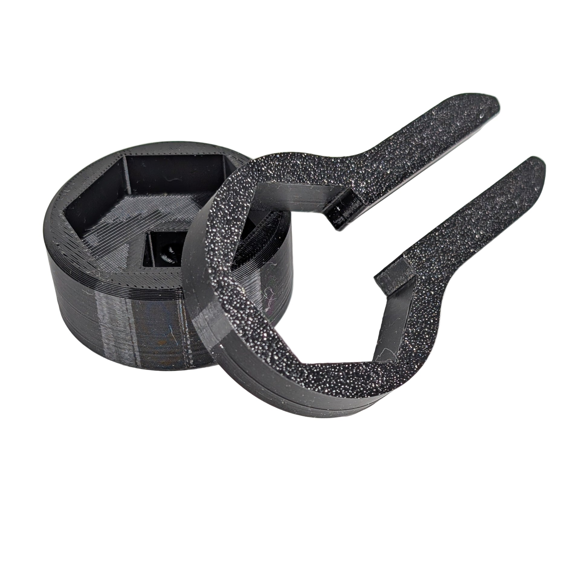 Close up view of two black M25 cable gland tools on a white background.