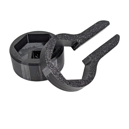 Close up view of two black M25 cable gland tools on a white background.