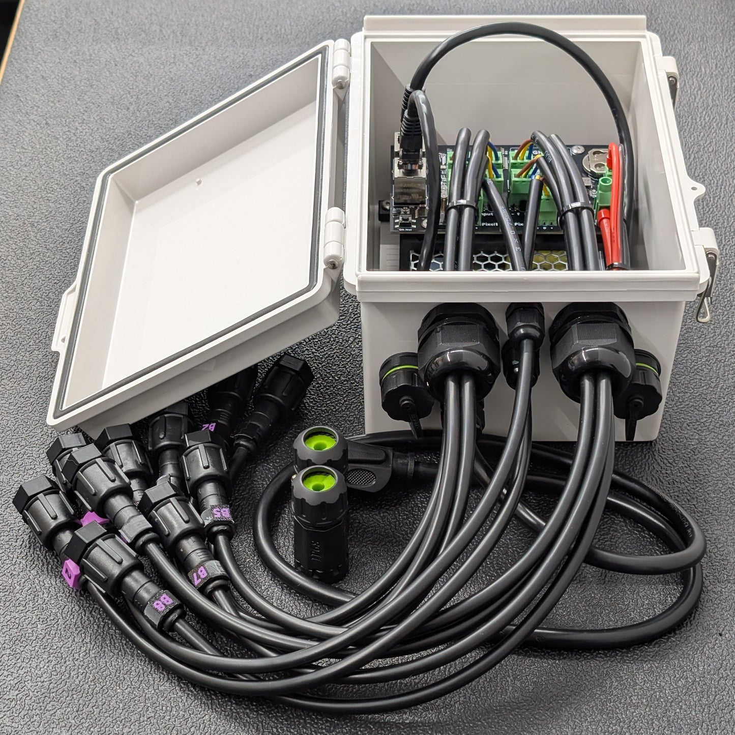 Open enclosure – left angle, showing Ethernet/USB access and cable glands