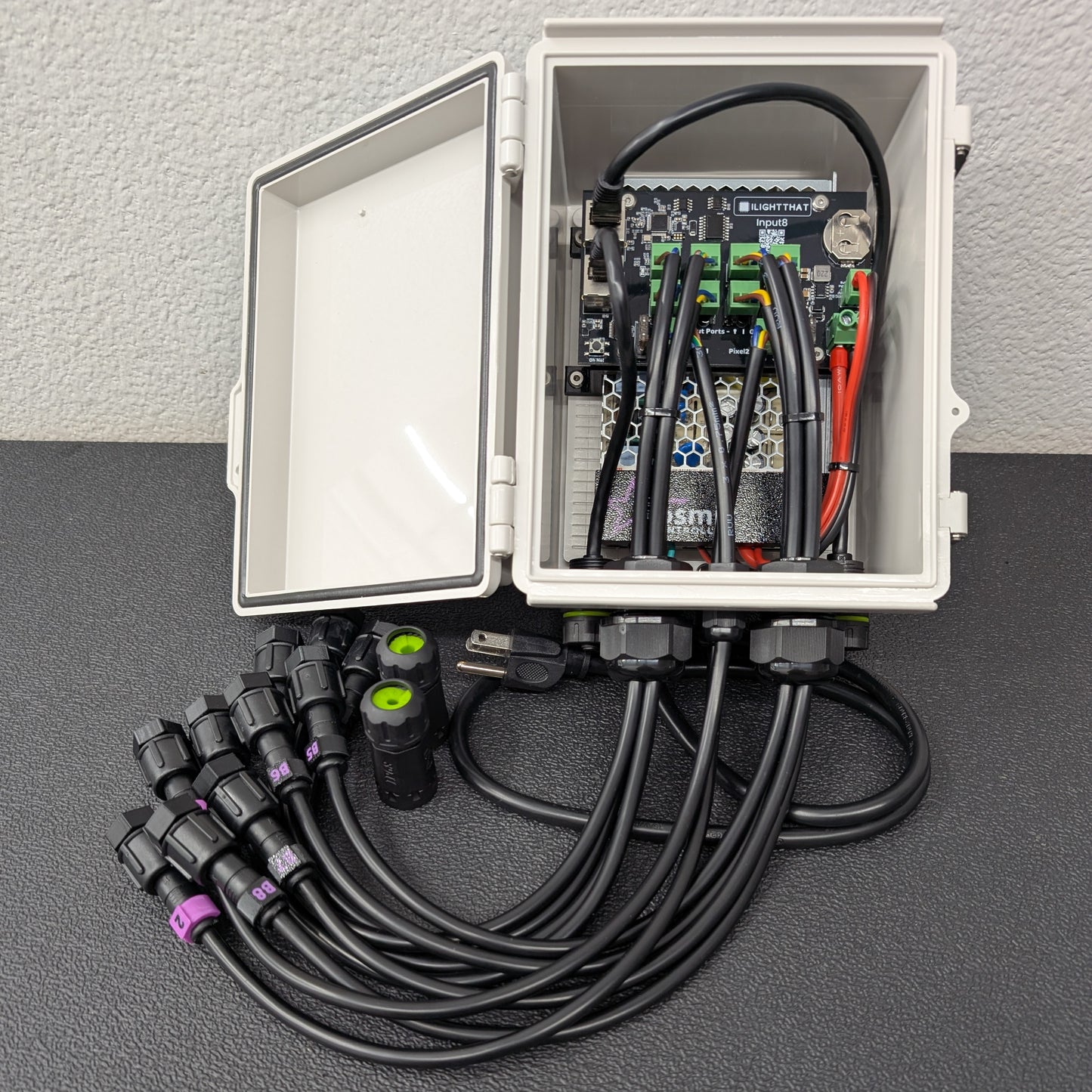 Open enclosure showing wiring, inputs, and pixel ports – right angle