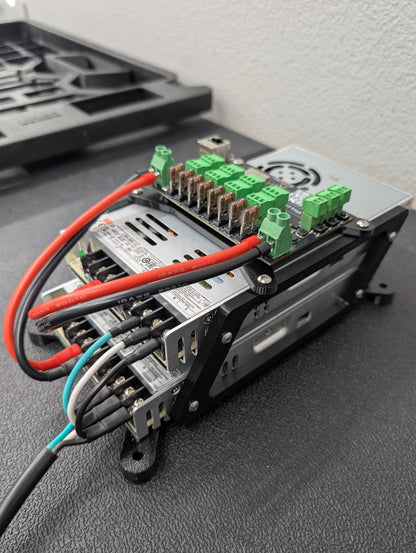 Close up of two power supplies with Baldrick8 RGB pixel controller board mounted on top