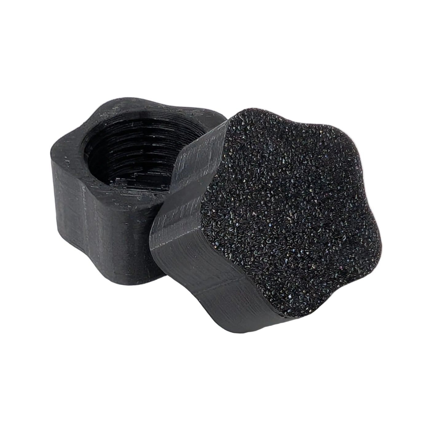 Star shaped black plastic threaded xConnect cap on a white background